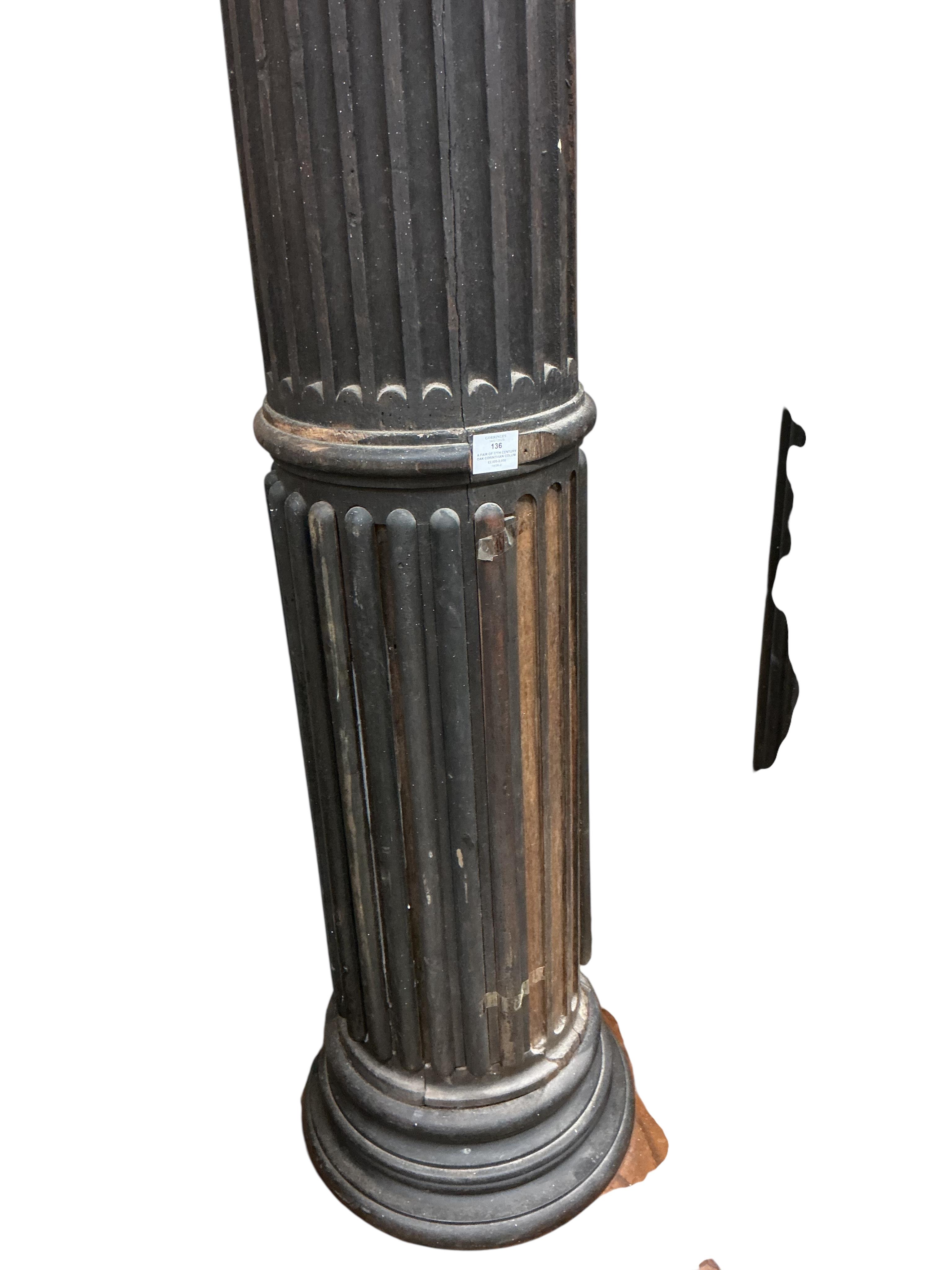 A pair of 17th century oak Corinthian columns, of large size, height 279cm, by repute from St Mary le Bow, designed by Christopher Wren